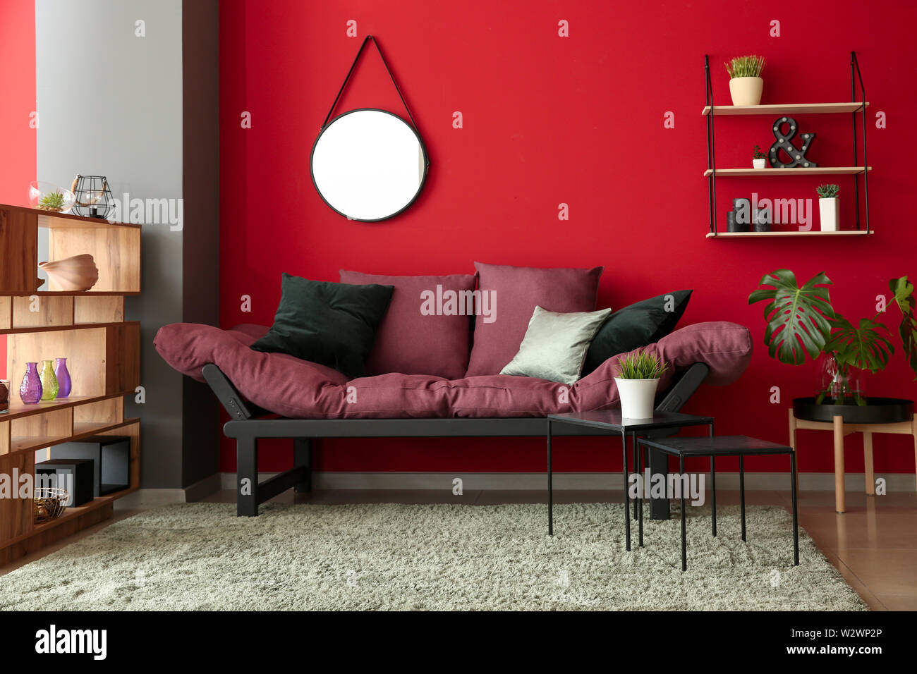 Interior of modern room with comfortable sofa Stock Photo - Alamy