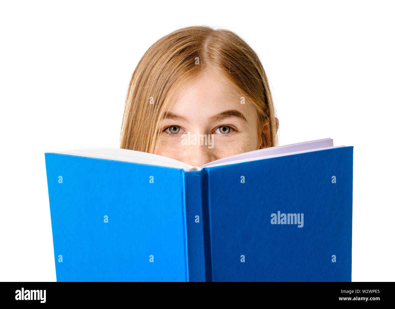 Cute teenage girl with book on white background Stock Photo - Alamy