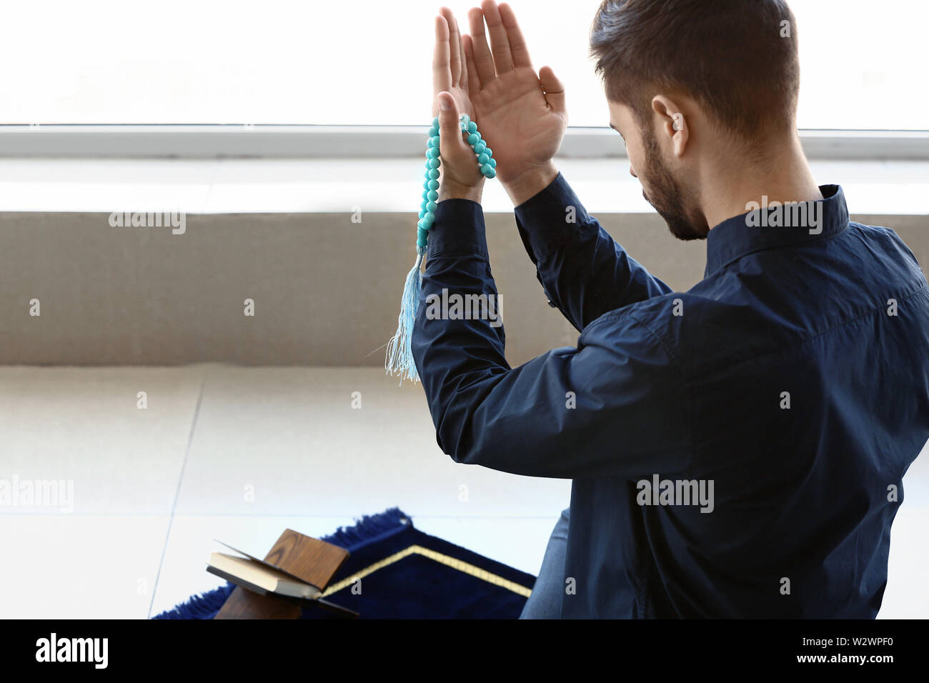Muslim man sitting praying hands hi-res stock photography and images ...
