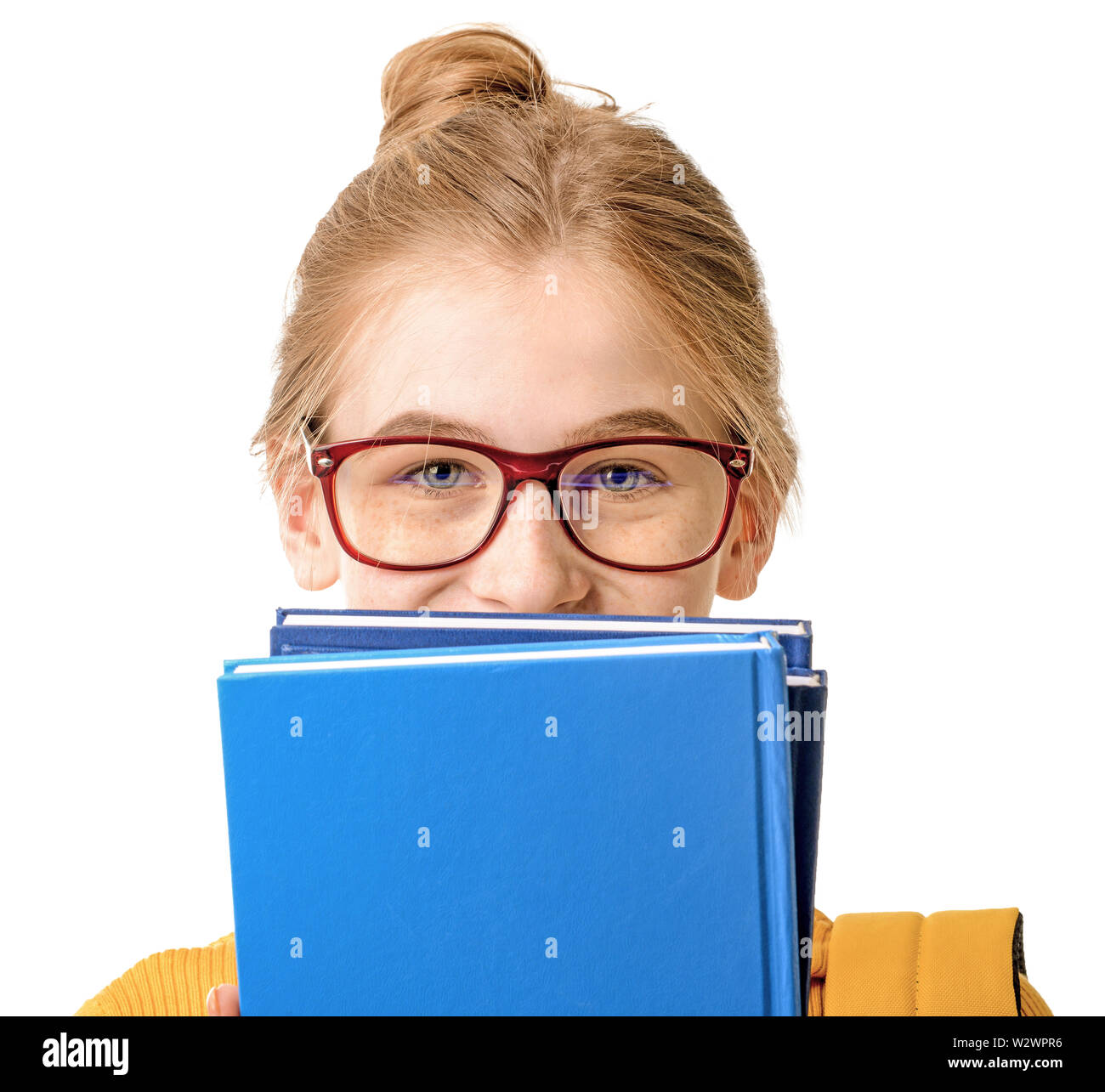 Cute teenage girl with books on white background Stock Photo - Alamy