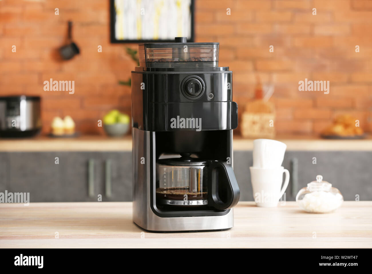 Modern coffee machine on table in kitchen Stock Photo Alamy