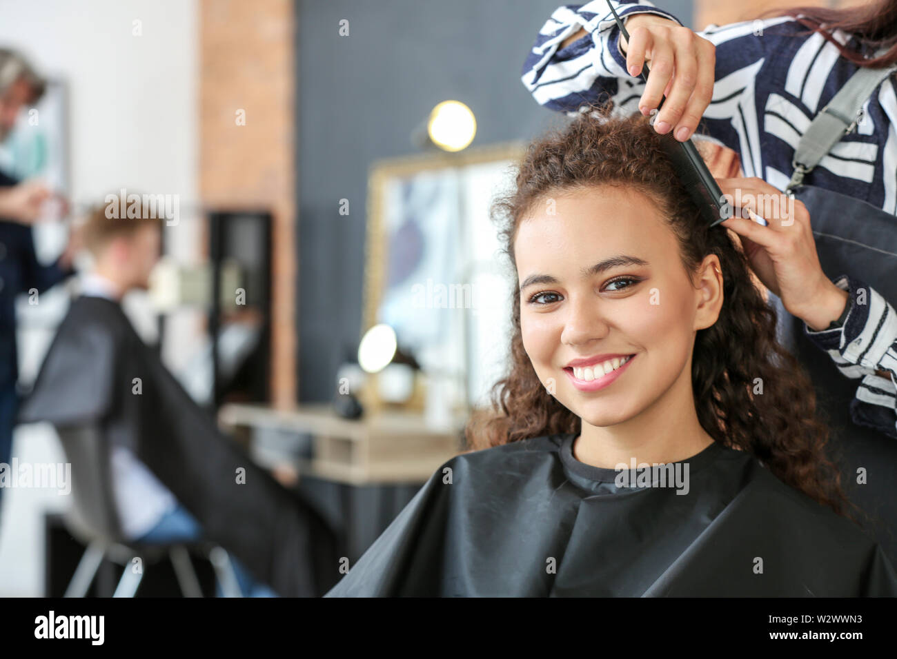 African American Hairdresser Working In Stock Photos African