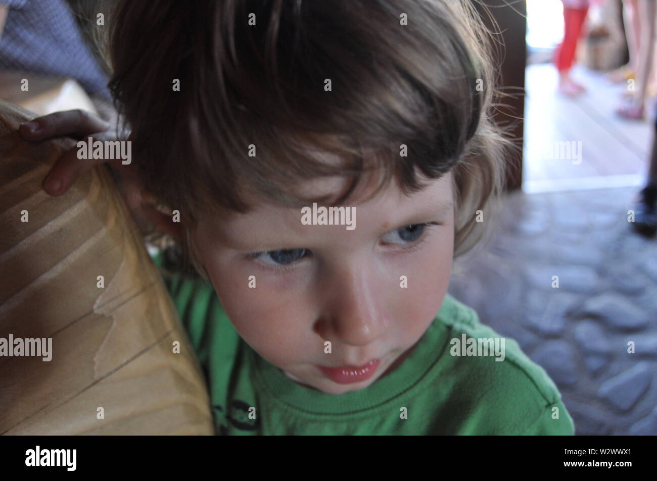 Portrait Of A Little Boy A Child With Curly Hair Stock Photo