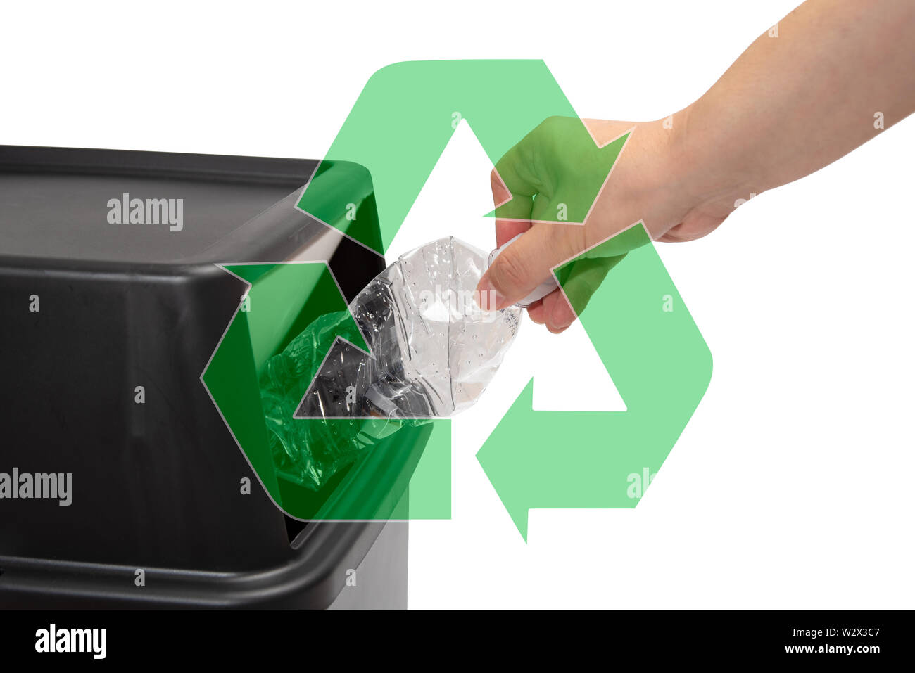 The hand of a man who throws a plastic bottle into a trash can. waste ...