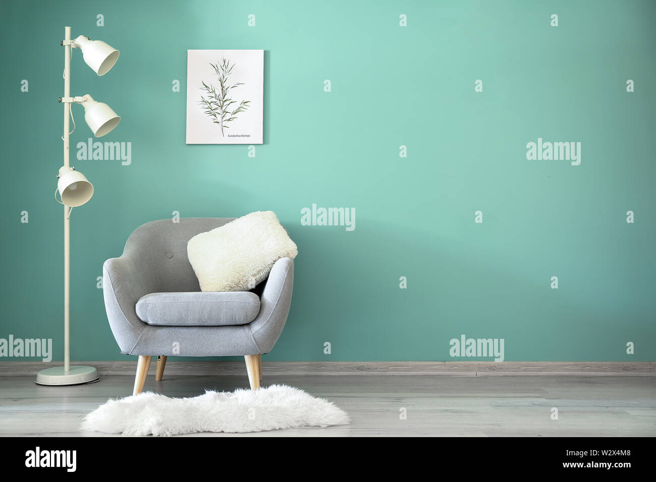 Interior of modern room with armchair and lamp Stock Photo - Alamy