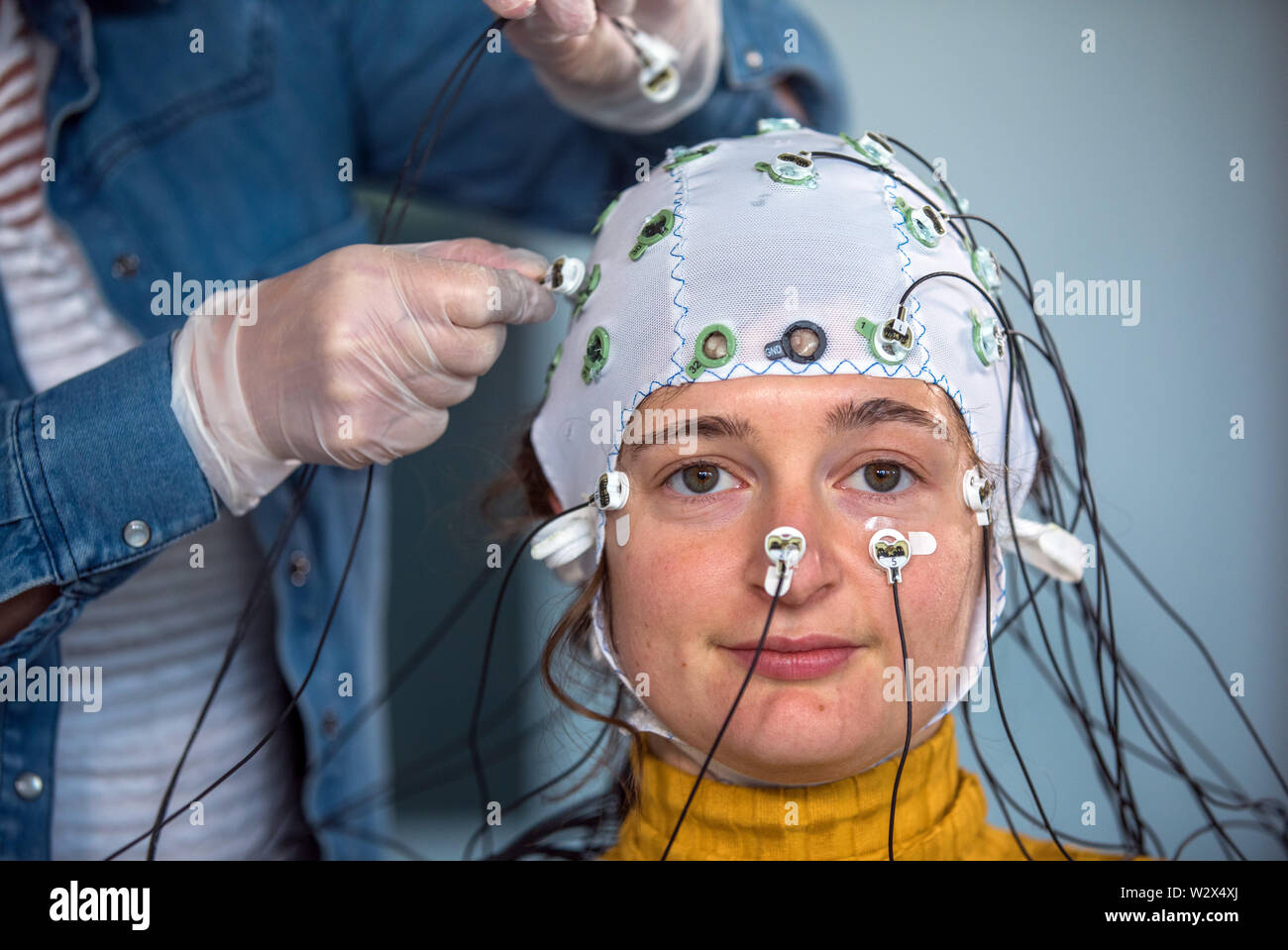 Magdeburg, Germany. 03rd May, 2019. A test person wears a hood with electrodes for measuring brain waves in the Laboratory of Neurobiology at the Leibniz Institute. Developmental psychologist Wetzel heads the CBBS Neurocognitive Development research group and, together with her team, investigates attention in childhood and in adults as well as the effects of distraction in thought and learning processes. (to dpa story 'Technology and Brain') Credit: Jens Büttner/dpa-Zentralbild/dpa/Alamy Live News Stock Photo