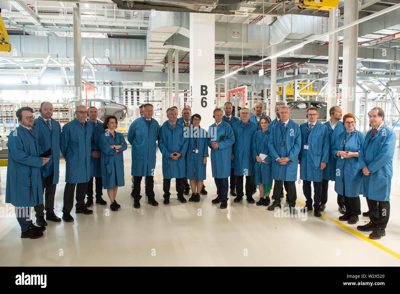 Hoce, Slovenia. 10th July, 2019. Visitors are posing for a group photo at  Magna paint shop plant.Magna Steyr launch new paint shop plant in Hoce,  Slovenia. Magna is one of the world's