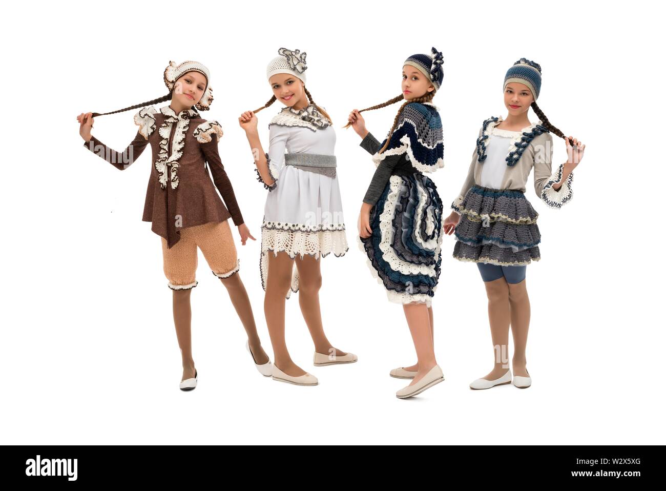 Pretty girls in original costumes and hats Stock Photo - Alamy