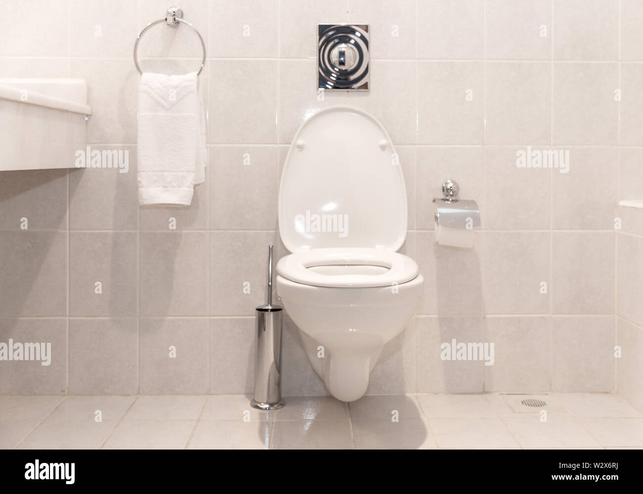 New ceramic toilet bowl near light white wall Stock Photo Alamy