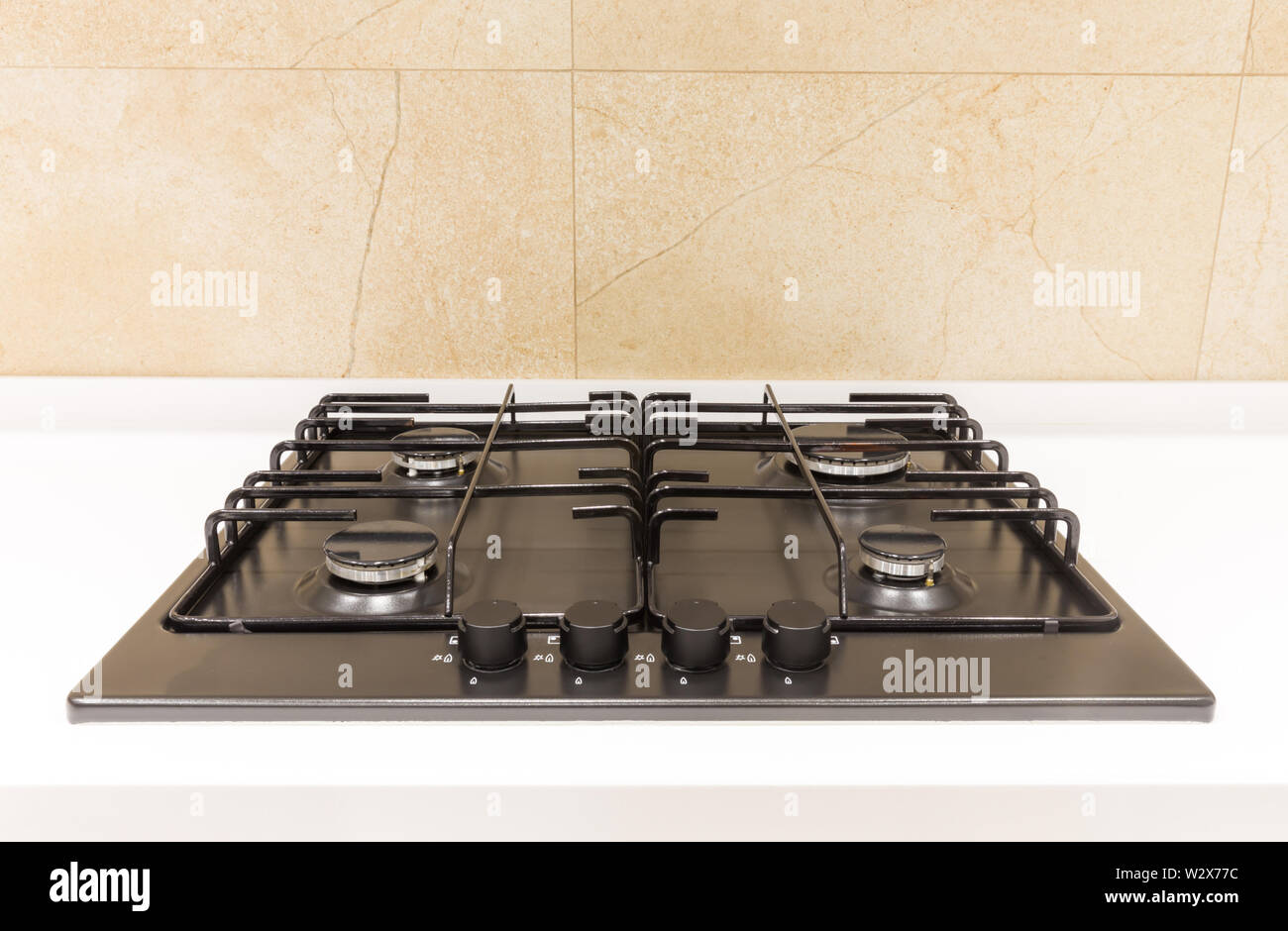 Gas burner on a black modern kitchen stove Stock Photo - Alamy