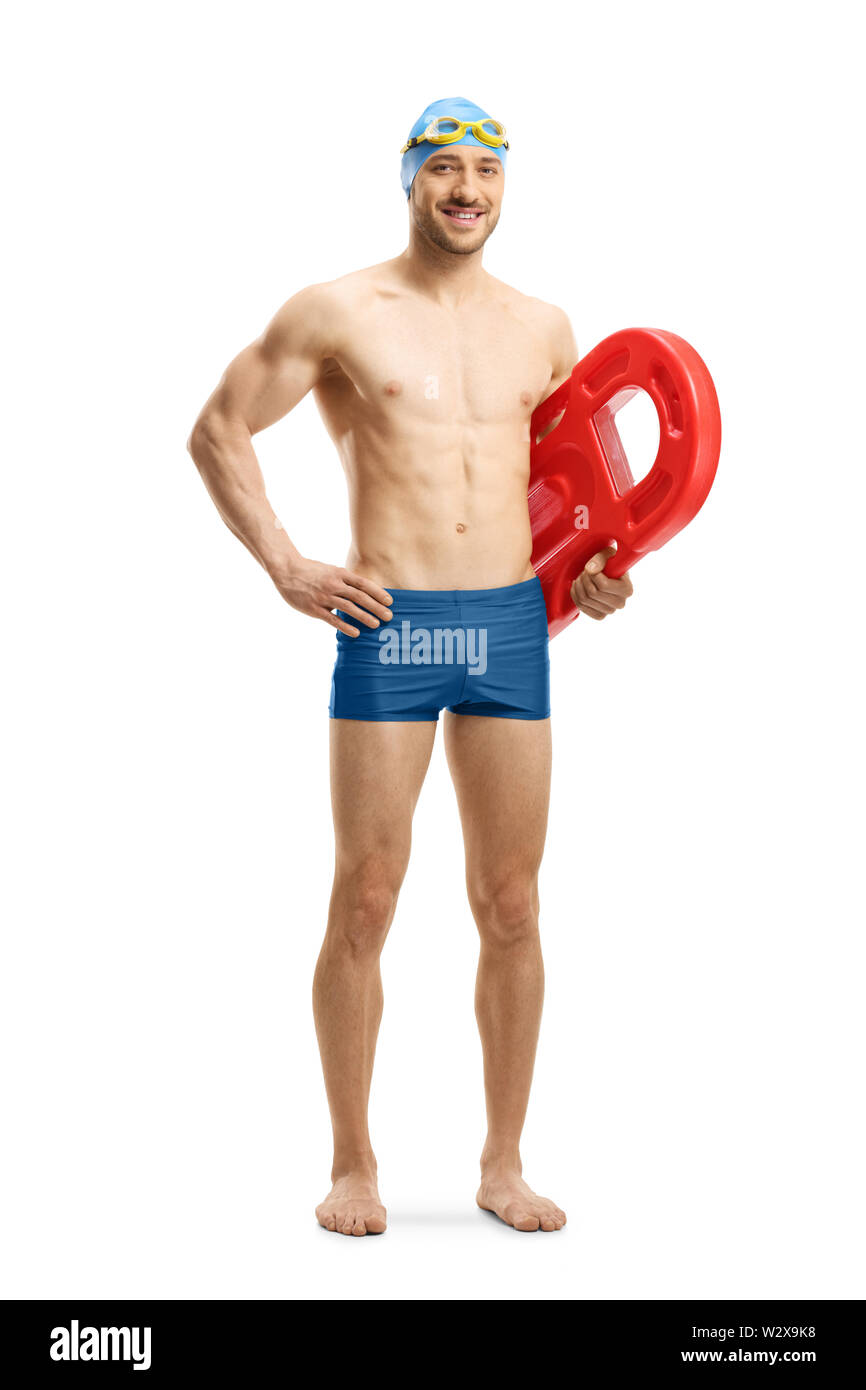 Full length portrait of a young muscular man wearing swimming shorts and holding a swimming float isolated on white background Stock Photo