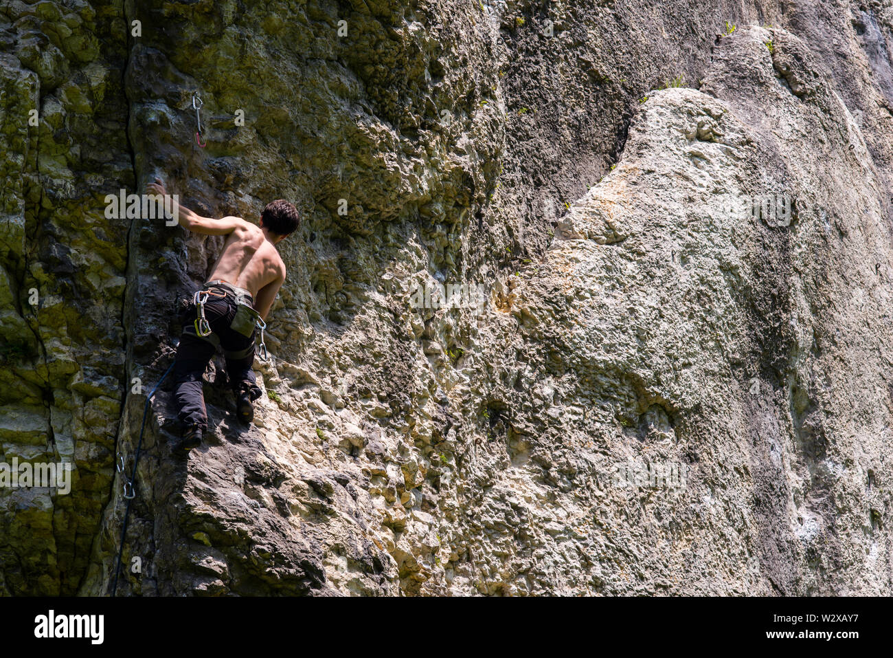 Men climbing vertical wall, Poland Stock Photo Alamy