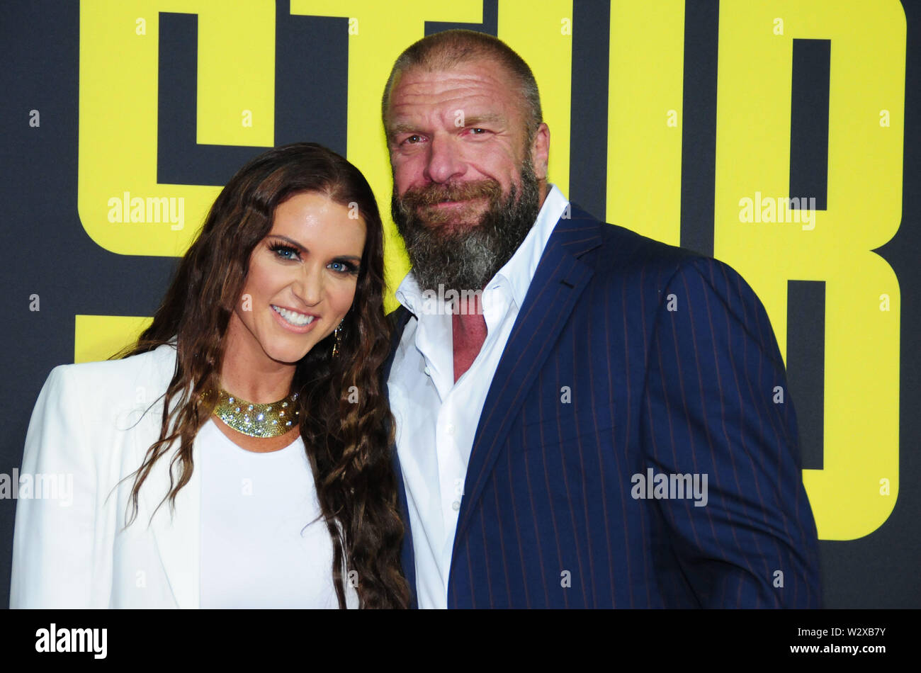Los Angeles, California, USA 10th July 2019 Chief Brand Officer of WWE Stephanie McMahaon and husband wrestler/actor Triple H, aka Paul Michael Levesque attend 20th Century Fox's 'Stuber' Premiere on July 10, 2019 at Regal Cinemas L.A. Live in Los Angeles, California, USA. Photo by Barry King/Alamy Live News Stock Photo