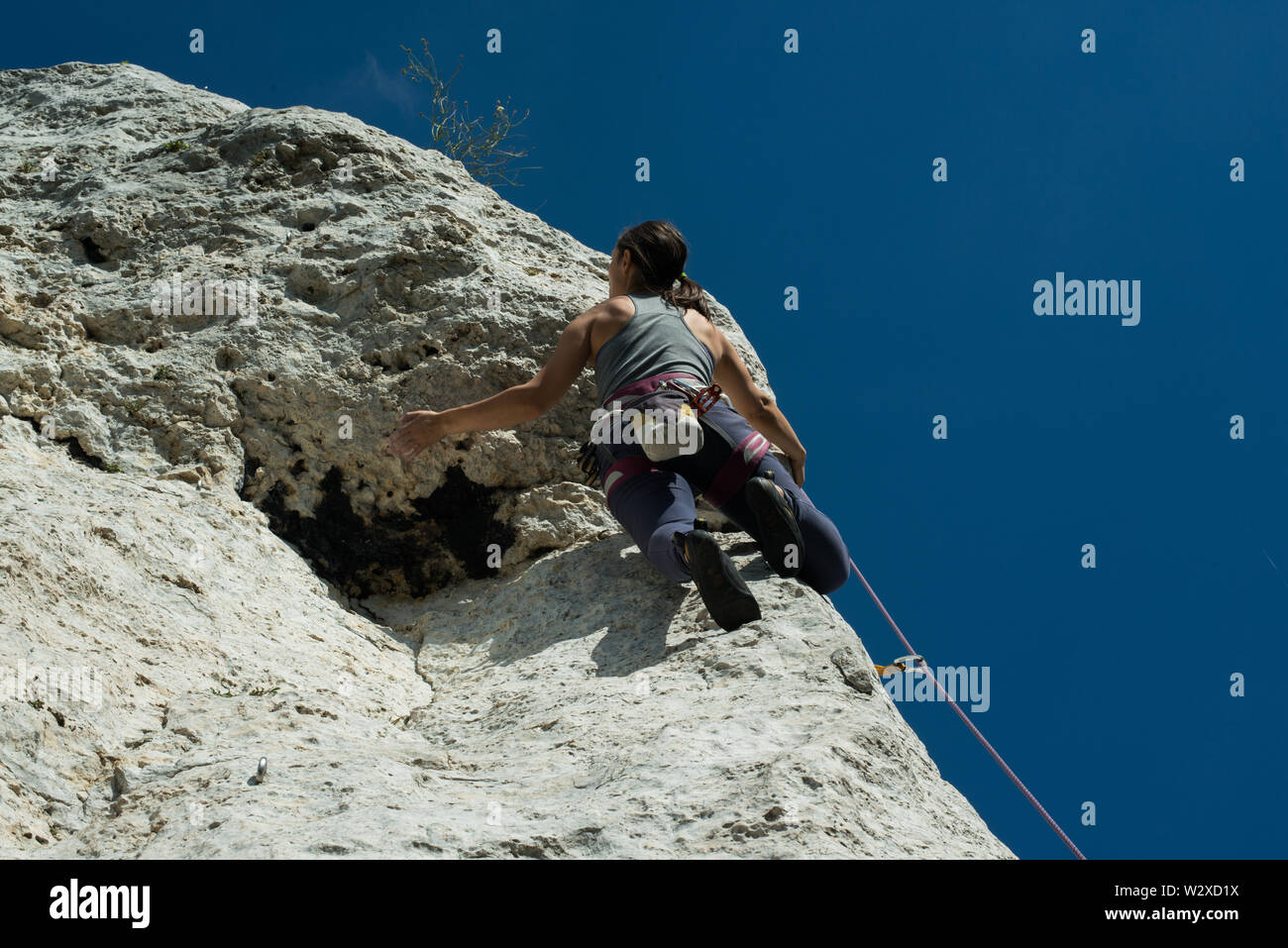 Women climbing vertical wall, Poland Stock Photo Alamy