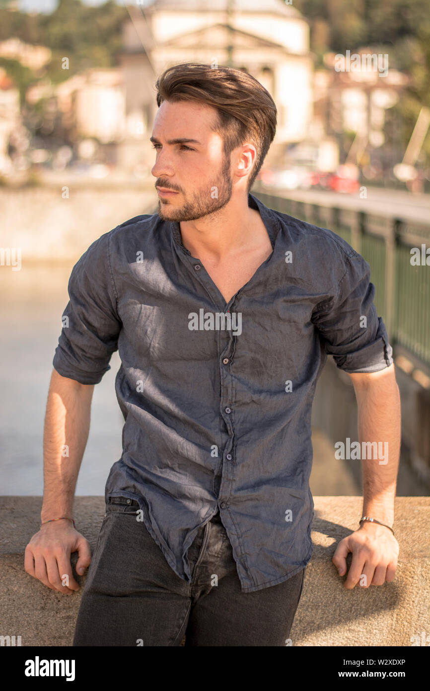 One handsome young man in city setting Stock Photo