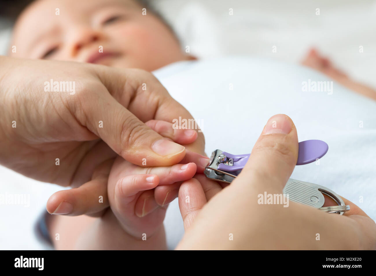 cut newborns finger with nail clippers