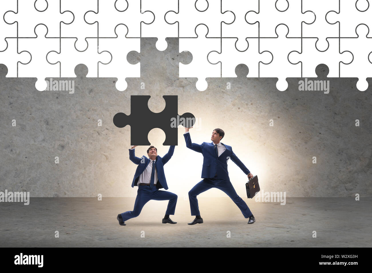 The concept of businessman with missing jigsaw puzzle piece Stock Photo ...