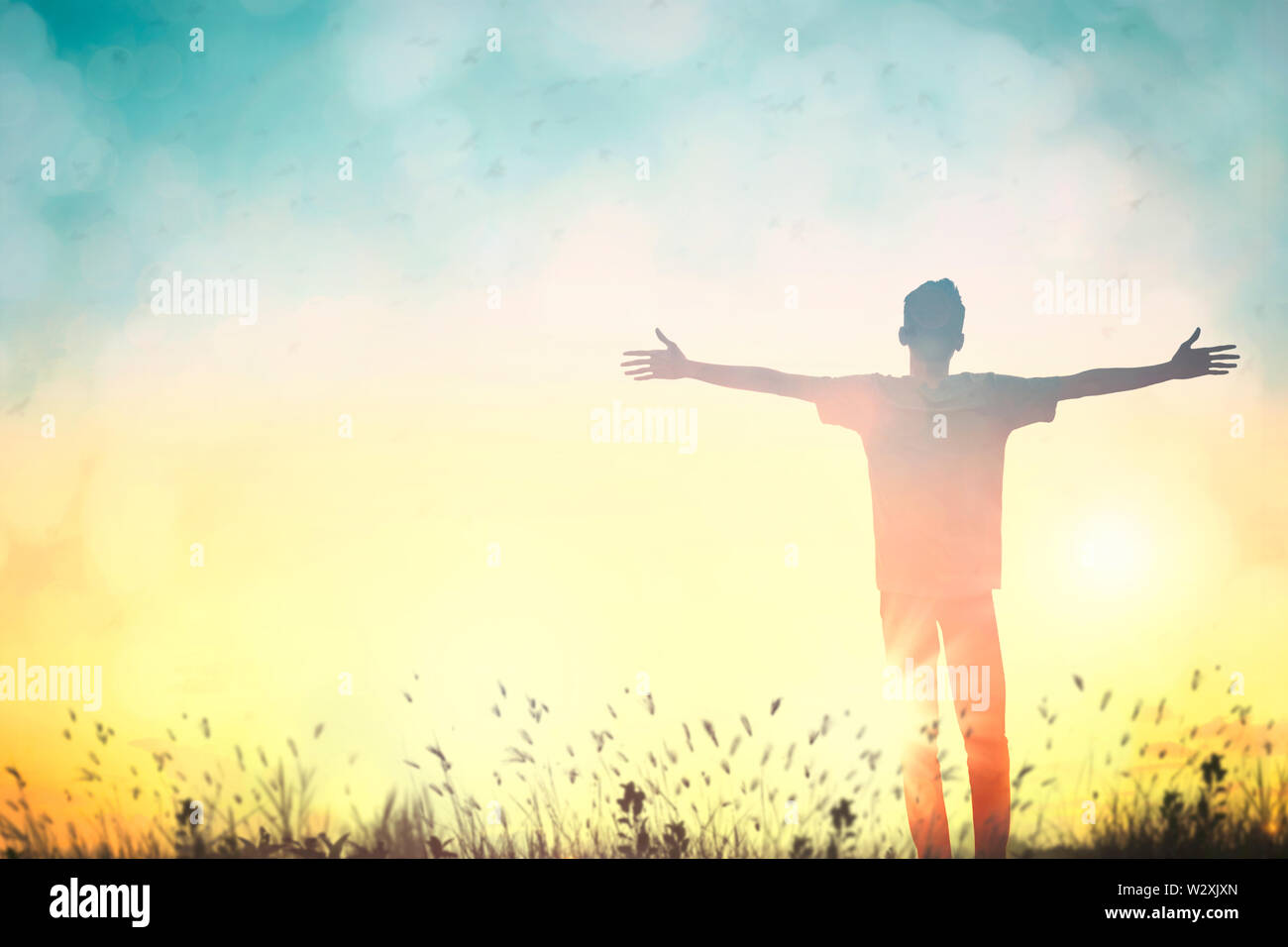 Happy man rise hand on morning view. Christian inspire praise God on