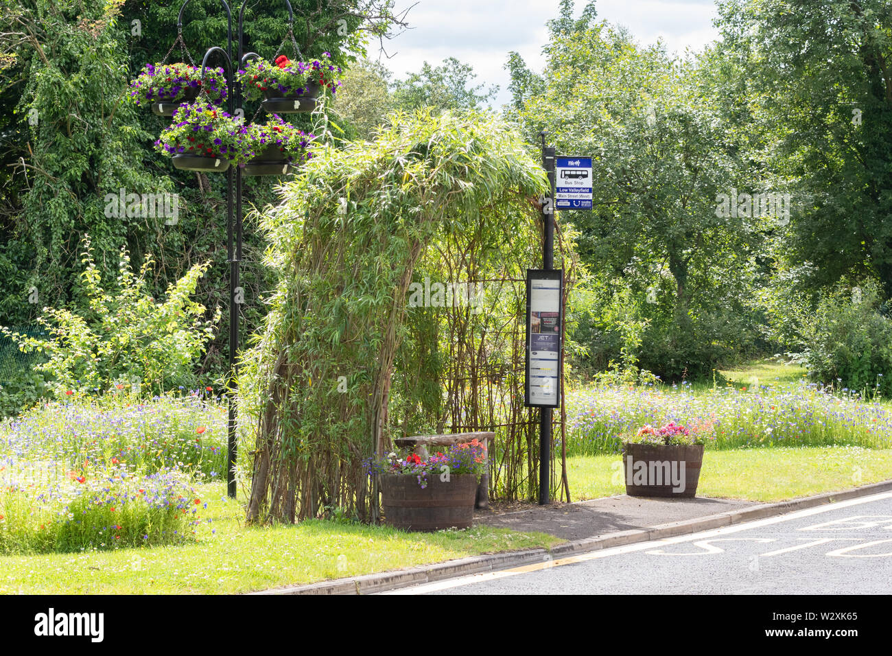 bus shelter made of living willow surrounded by annual flowers on the Fife Coastal Route  - Low Valleyfield,  Fife, Scotland, UK Stock Photo