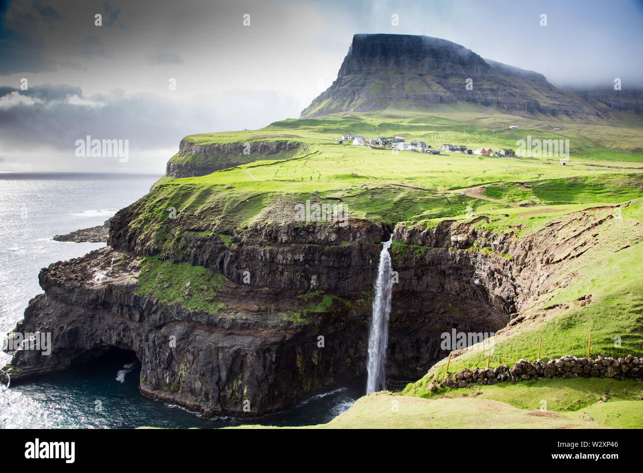 Gasadalur village and Beautiful waterfall. Vagar, Faroe Islands, Denmark Stock Photo
