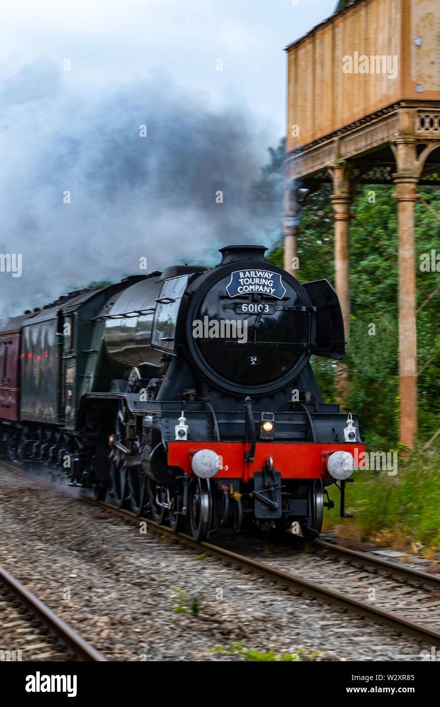The Iconic Steam Train Called The Flying Scotsman As I Came  Through The Kemble Train Station .Being Watched By Hundreds Of People From Allover . Stock Photo