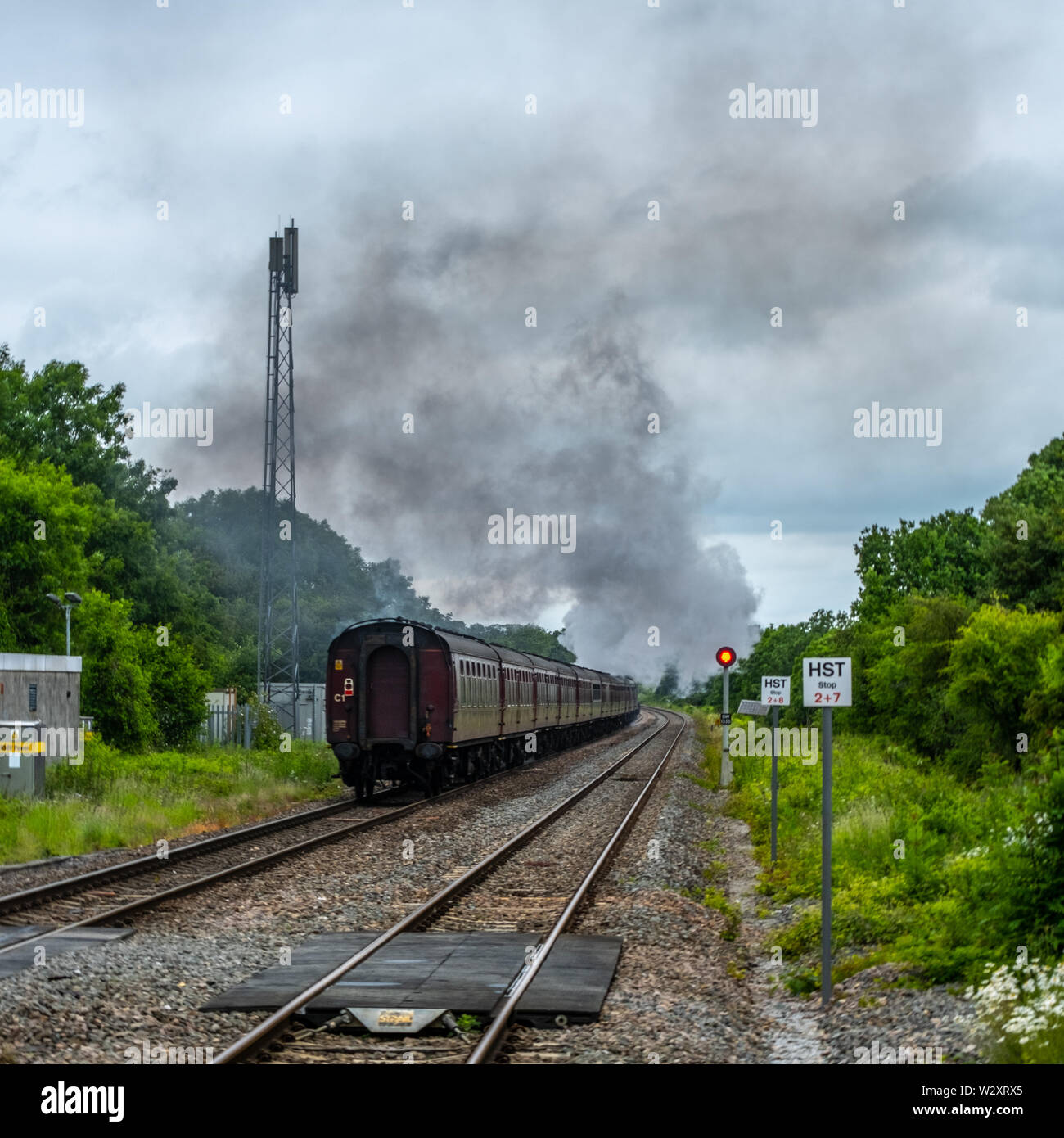 The Iconic Steam Train Called The Flying Scotsman As I Came  Through The Kemble Train Station .Being Watched By Hundreds Of People From Allover . Stock Photo