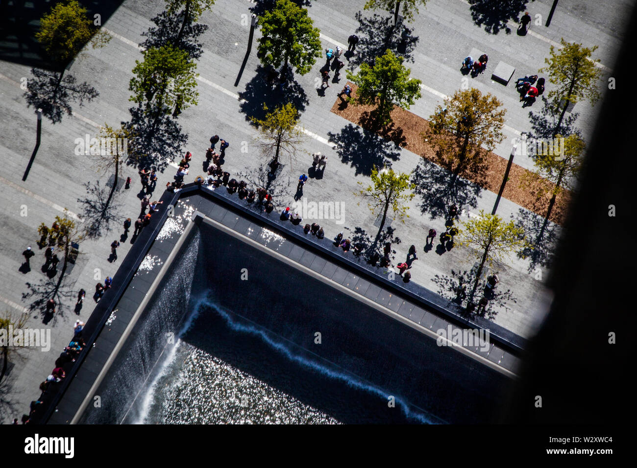 The reflecting pools in the 9/11 Memorial Park at Ground Zero as seen from the 73rd floor of the WTC Tower under construction. Stock Photo