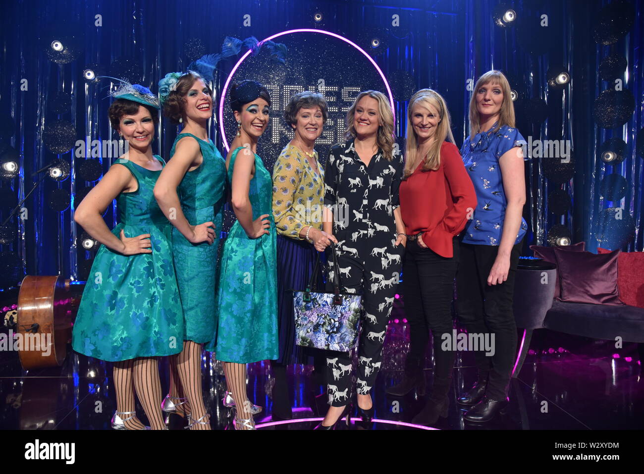 10 July 2019, North Rhine-Westphalia, Cologne: Trio Zucchini Sistaz ( Sinje Schnittker, Jule Balandat and Tina Werzinger ) , l-r, Lioba Albus, hostess Lisa Feller, Barbara Ruscher and Katinka Buddenkotte  guest on the recording of Ladies Night, a ARD cabaret television programme in which only women appear - broadcast date 08.08.2019, 22.45 in the first Photo: Horst Galuschka/dpa/Horst Galuschka dpa Stock Photo