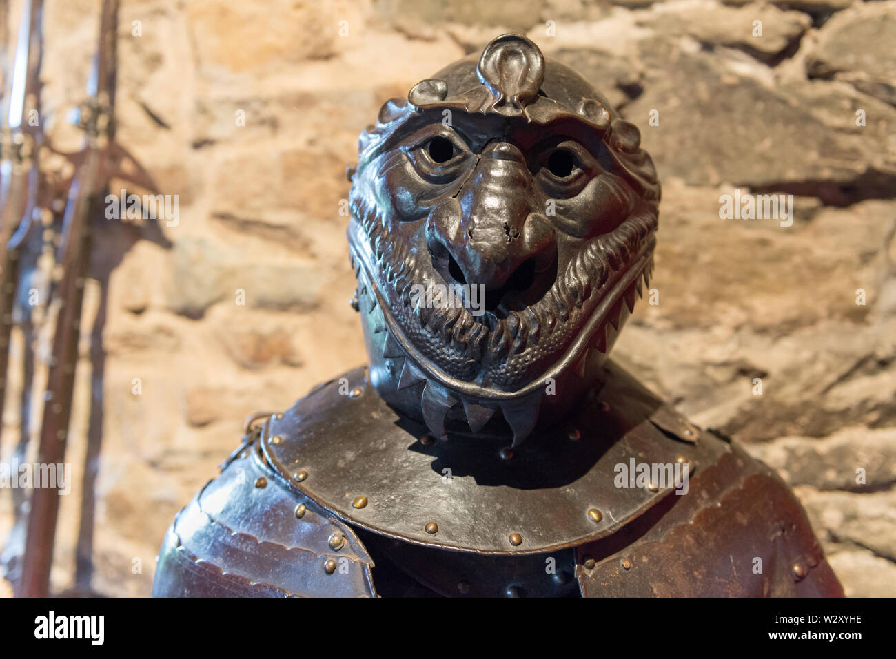 Medieval knight&rsquo;s tournament armor with mocking helmet displayed in the