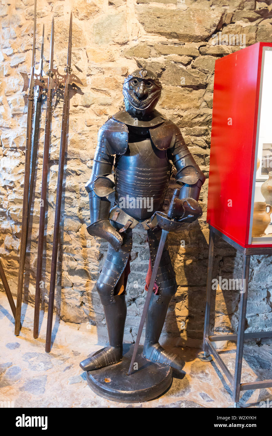 Medieval knight&rsquo;s tournament armor with mocking helmet displayed in the