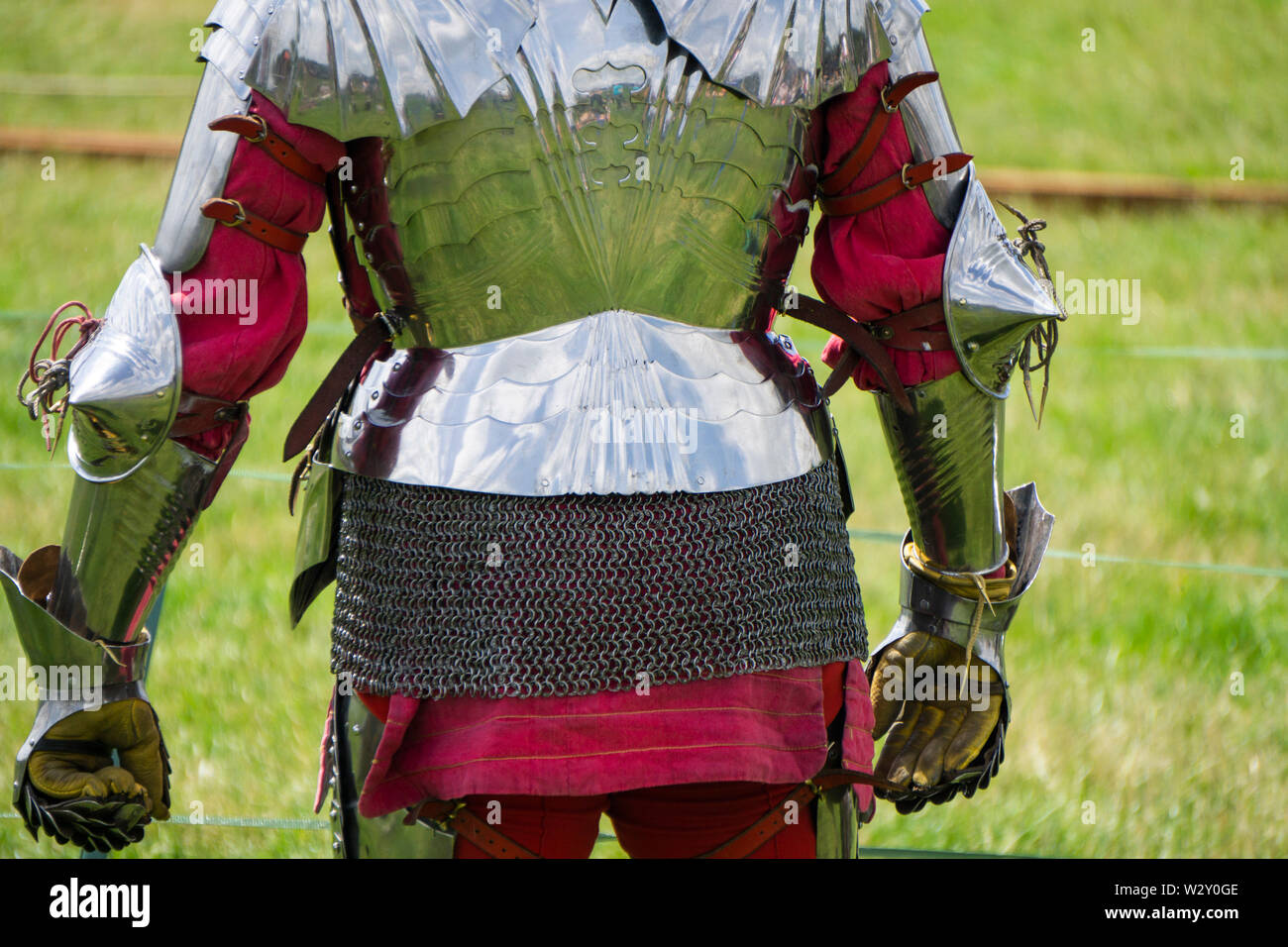 A knight standing wearing shiny armour Stock Photo