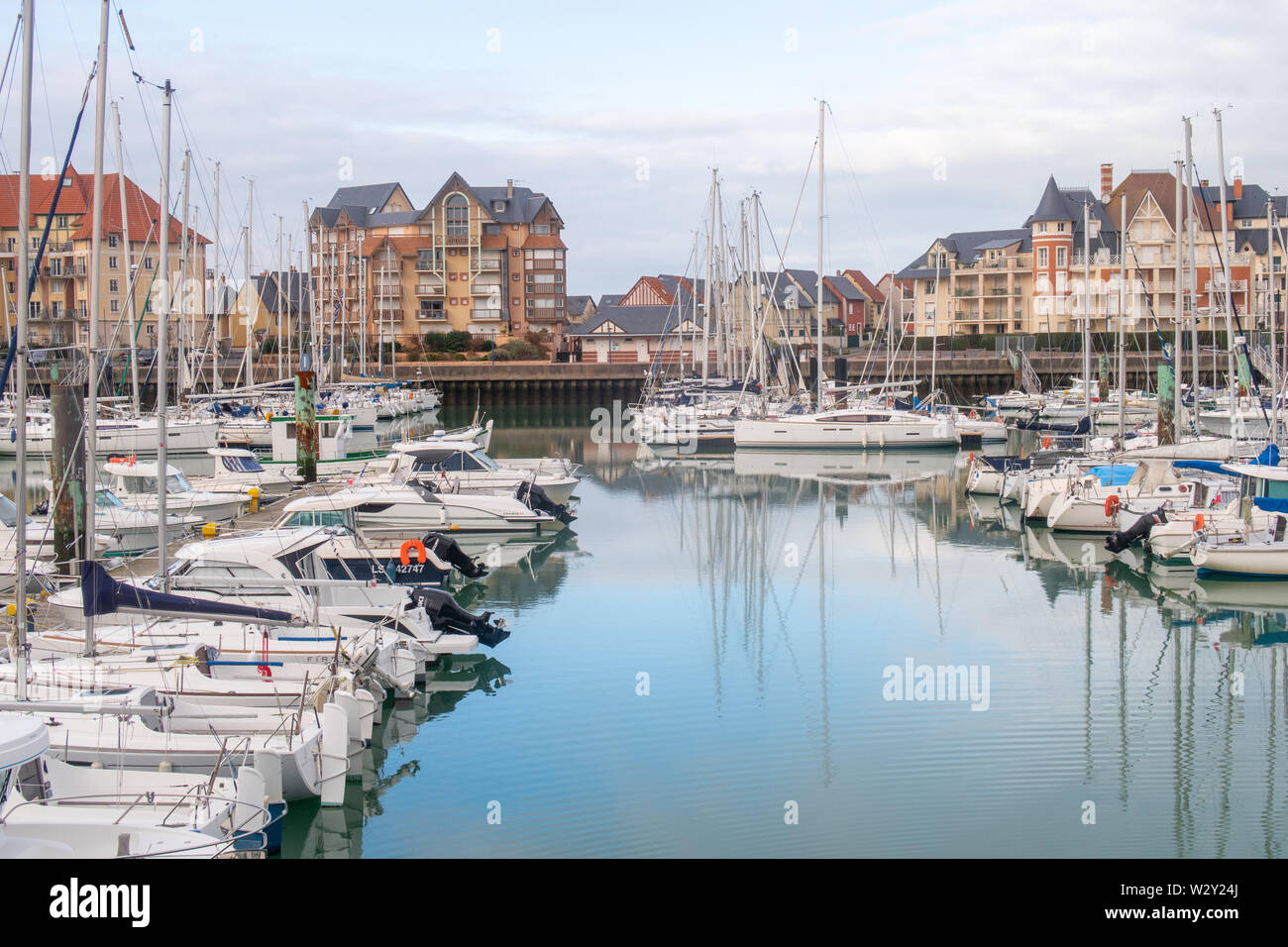 Dives-Sur-Mer, France - January 3, 2019: the harbour, boats, and buildings at dives-sur-mer Stock Photo