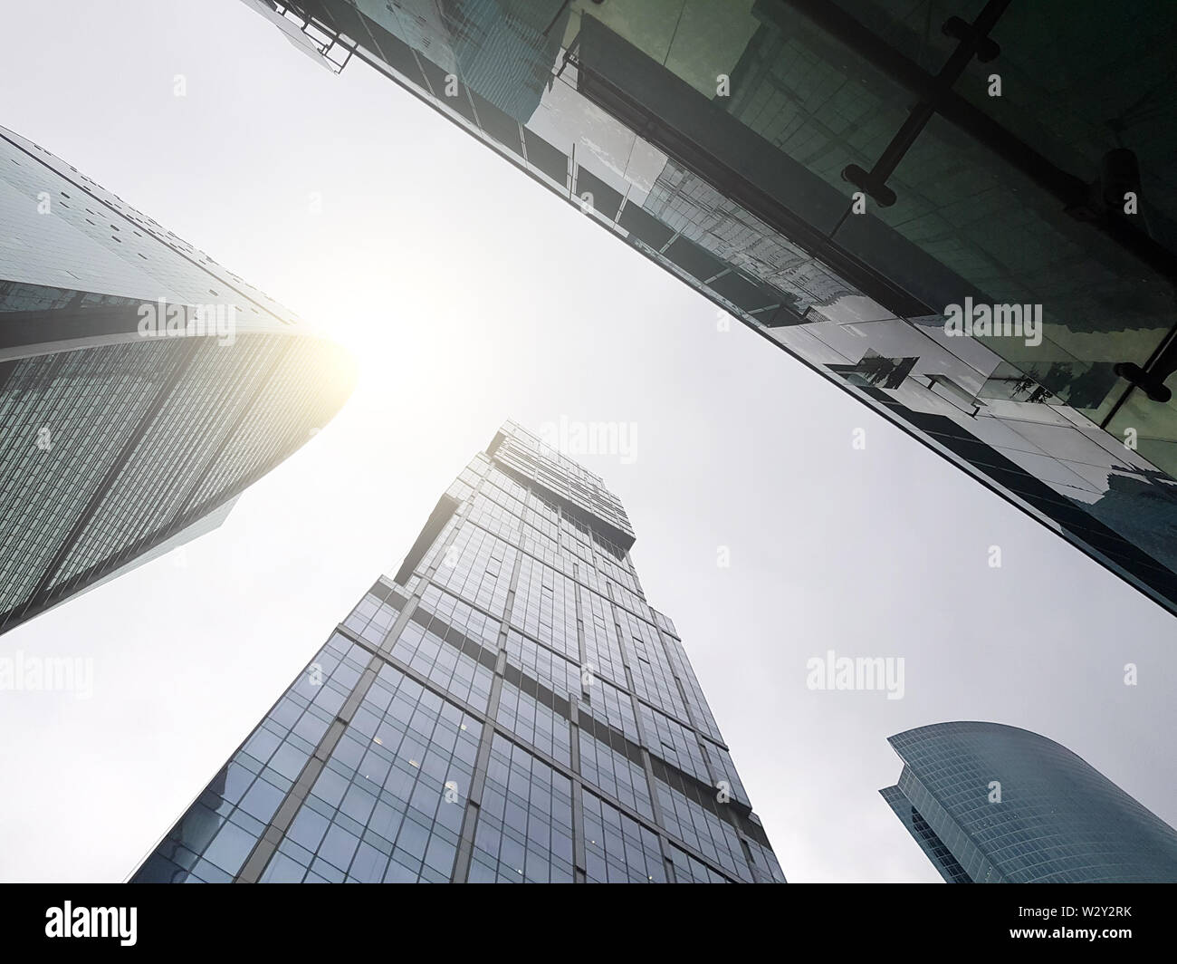 Photo from below of tall buildings and blue sky Stock Photo