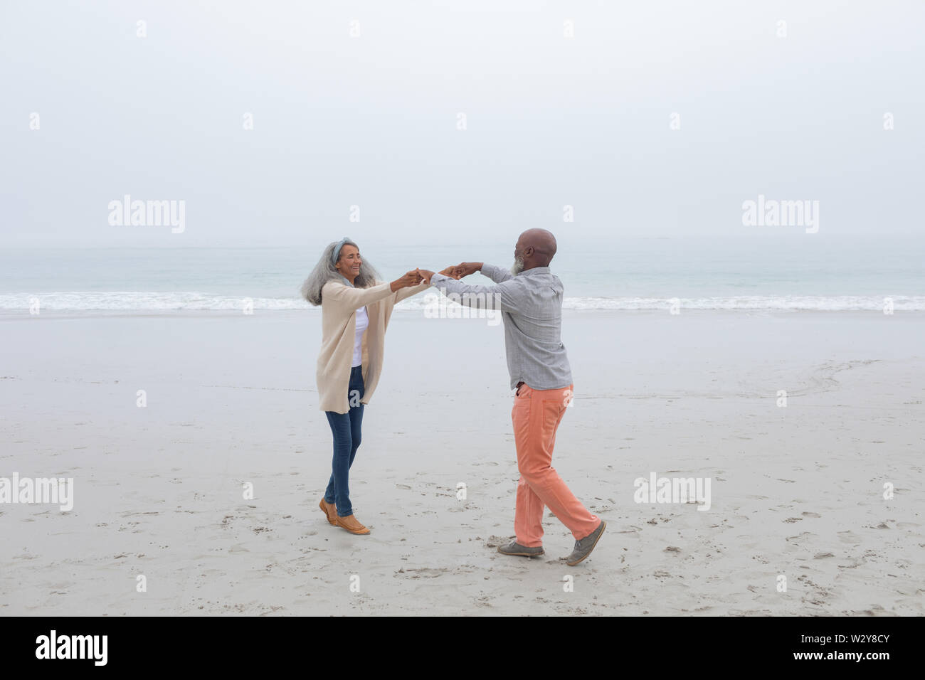 Couple dancing at the beach Stock Photo