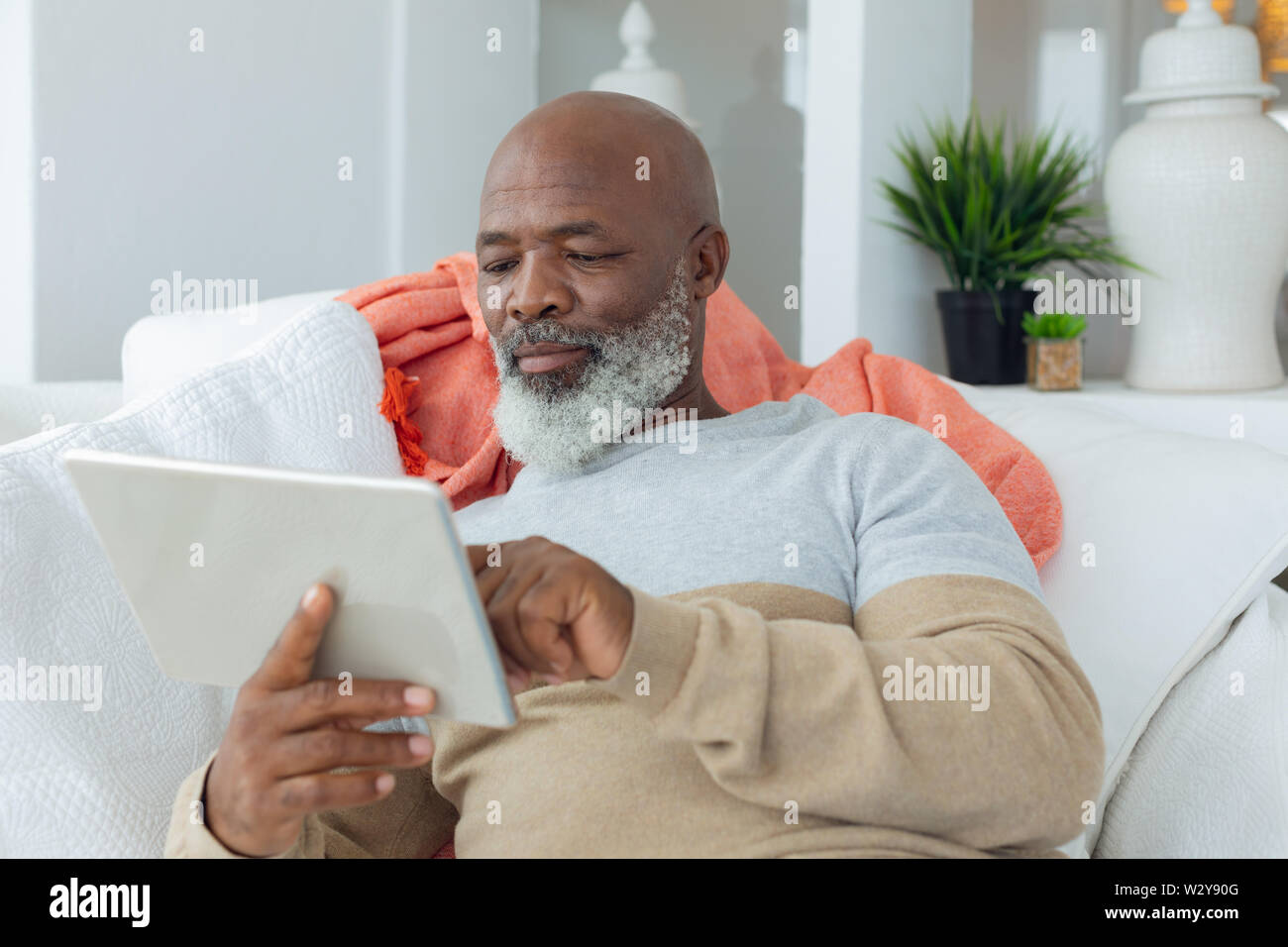 Man using digital tablet Stock Photo
