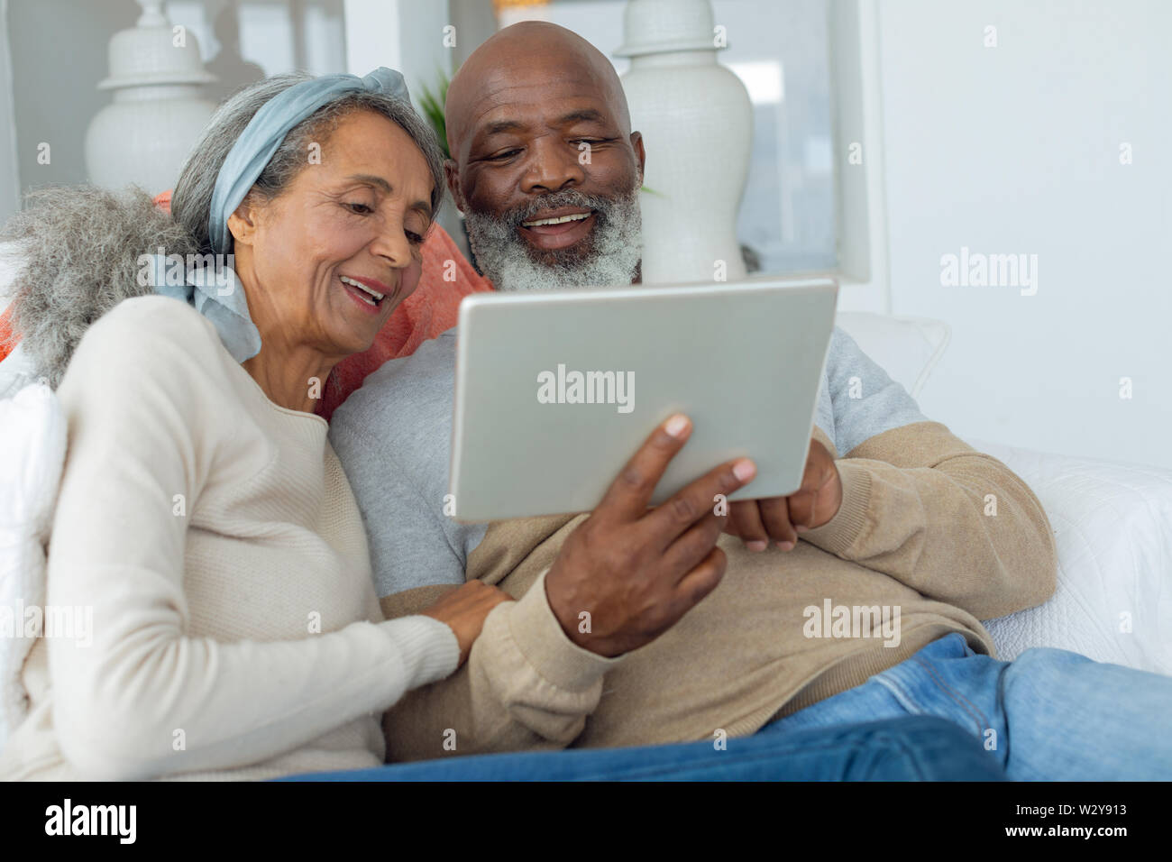 Couple using digital tablet Stock Photo