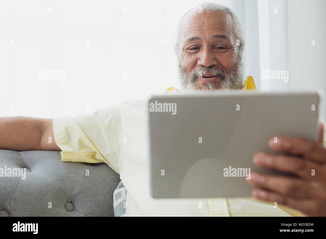 Man using digital tablet Stock Photo