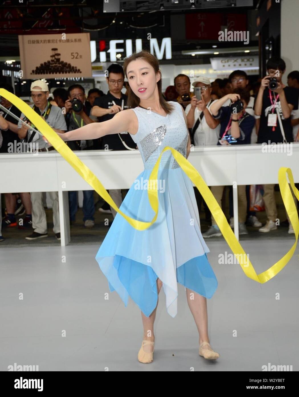 Shanghai, Shanghai, China. 11th July, 2019. Shanghai, China - July 11 2019:  The Shanghai photographic equipment exhibition is now underway.In addition  to numerous models, there are rope drill shows, cheerleading performances,  king