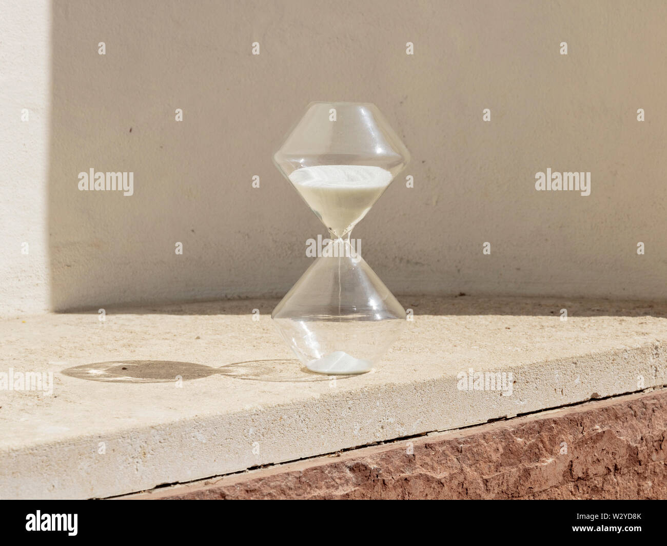 Hourglass and Sun Measuring Time Stock Photo Alamy