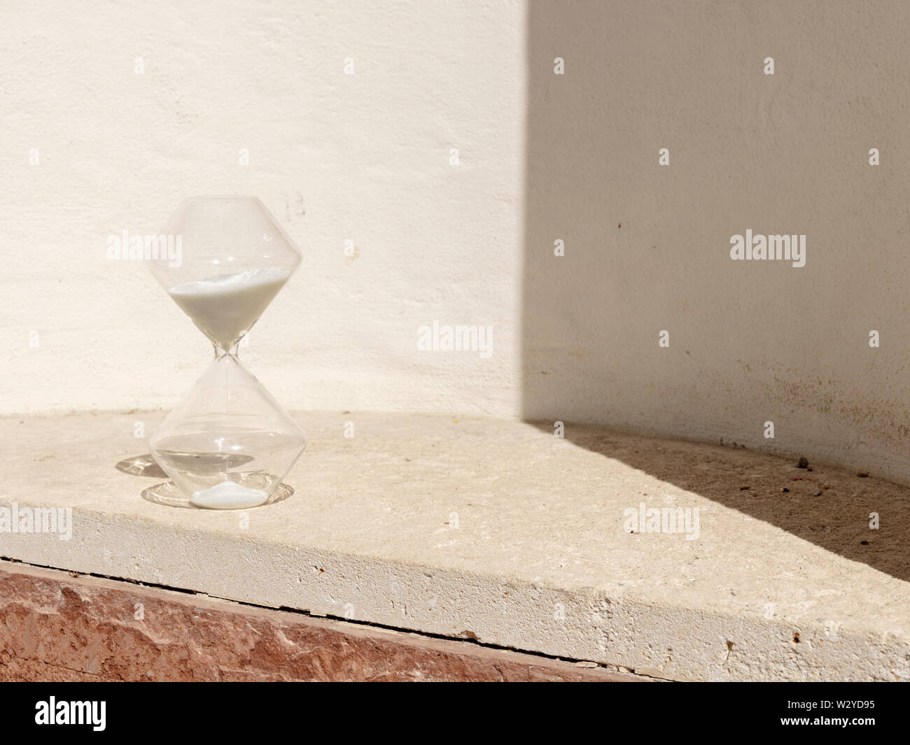 Hourglass and Sun Measuring Time Stock Photo Alamy