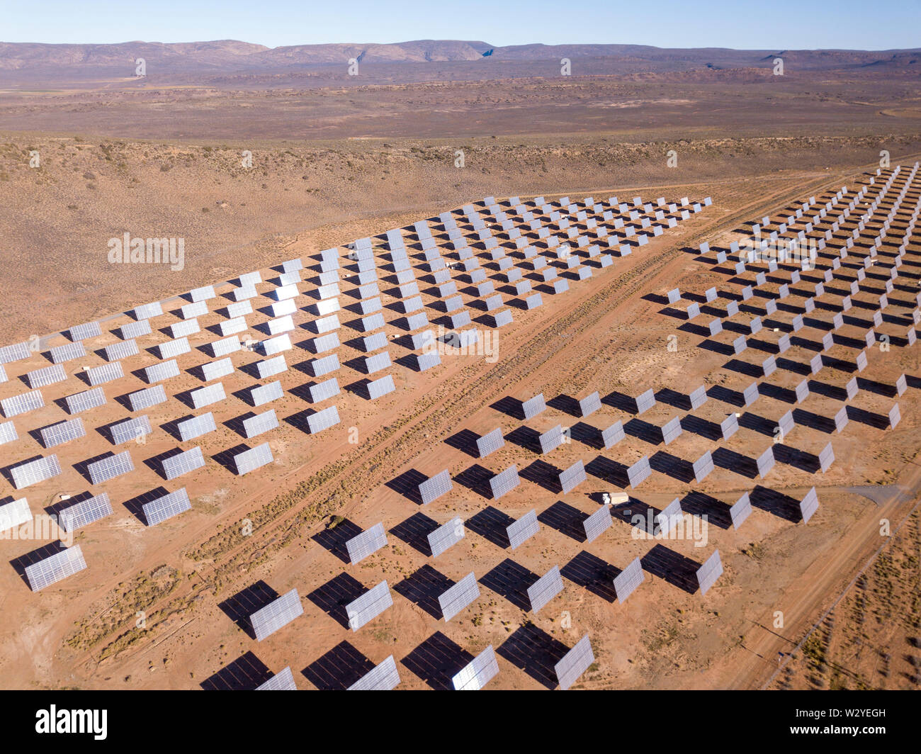 Aerial over solar panels in a dry landscape Stock Photo