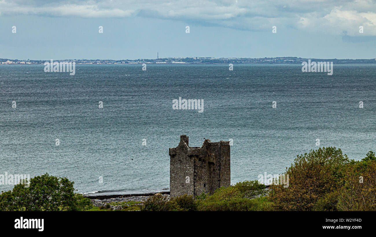 Gleninagh Castle, a 16thcentury tower house in the Burren with the sea