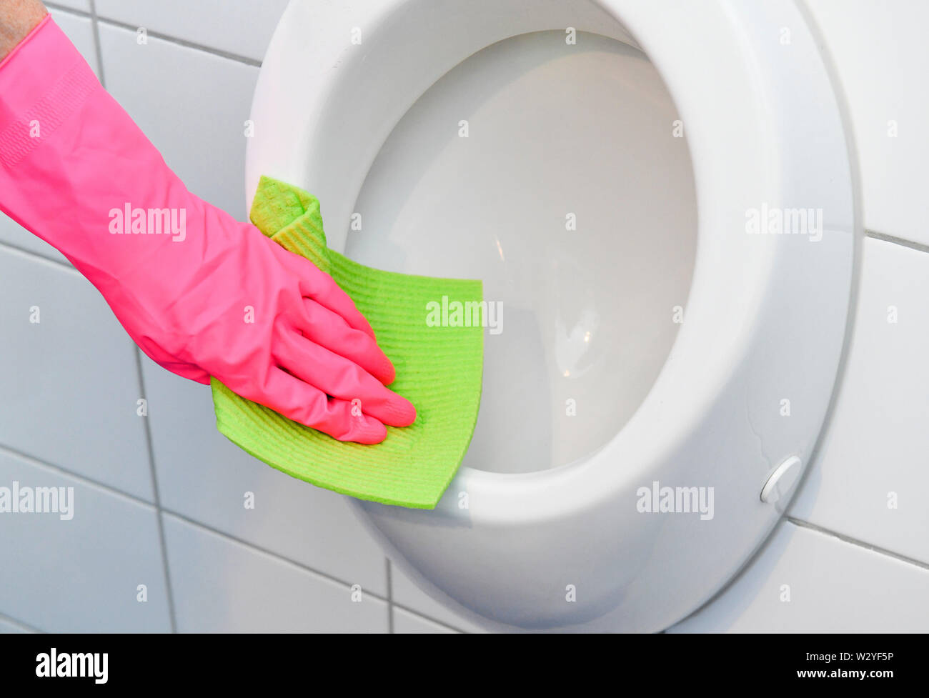 cleaning urinal Stock Photo