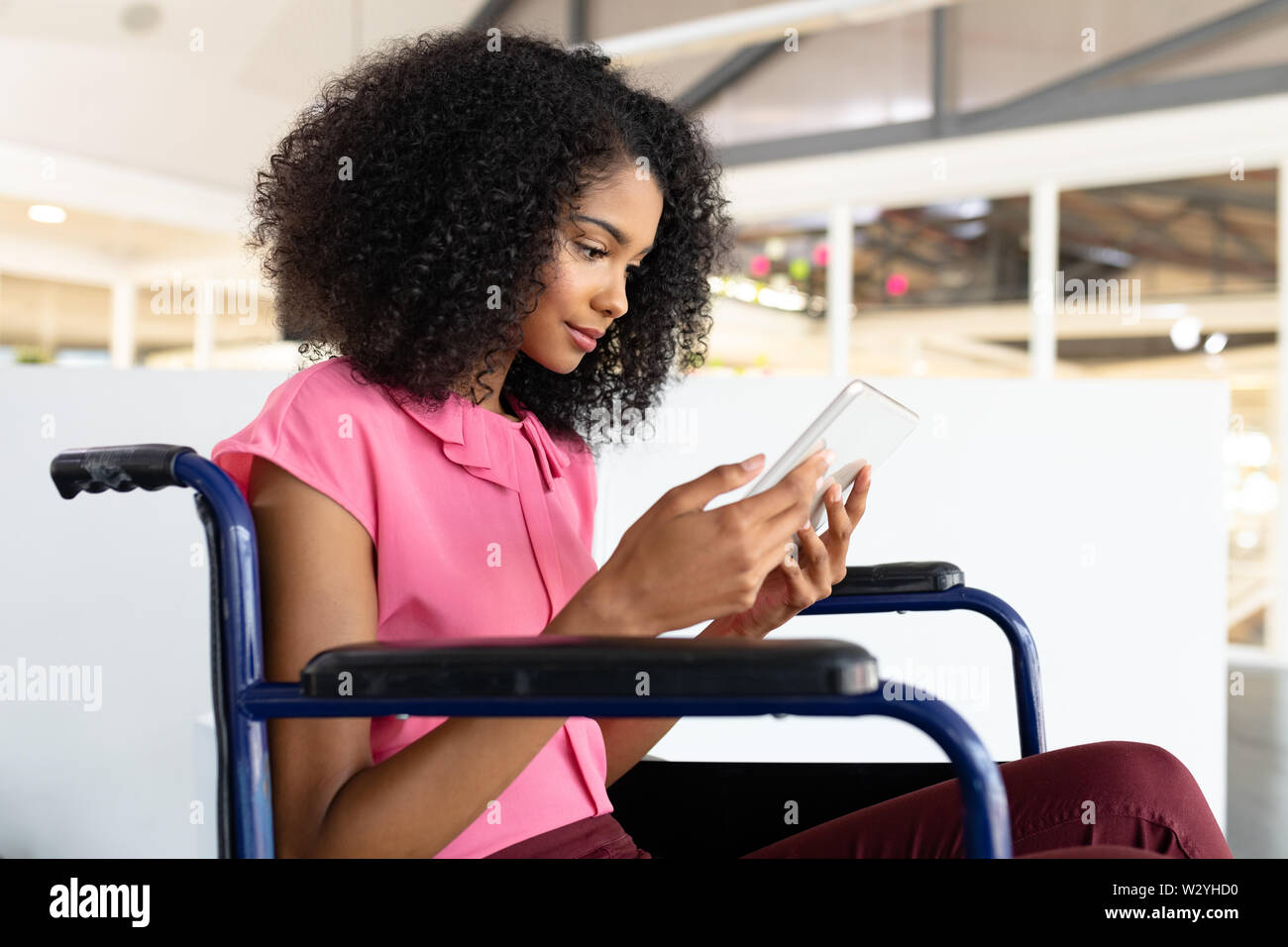Female graphic designer using digital tablet in office Stock Photo
