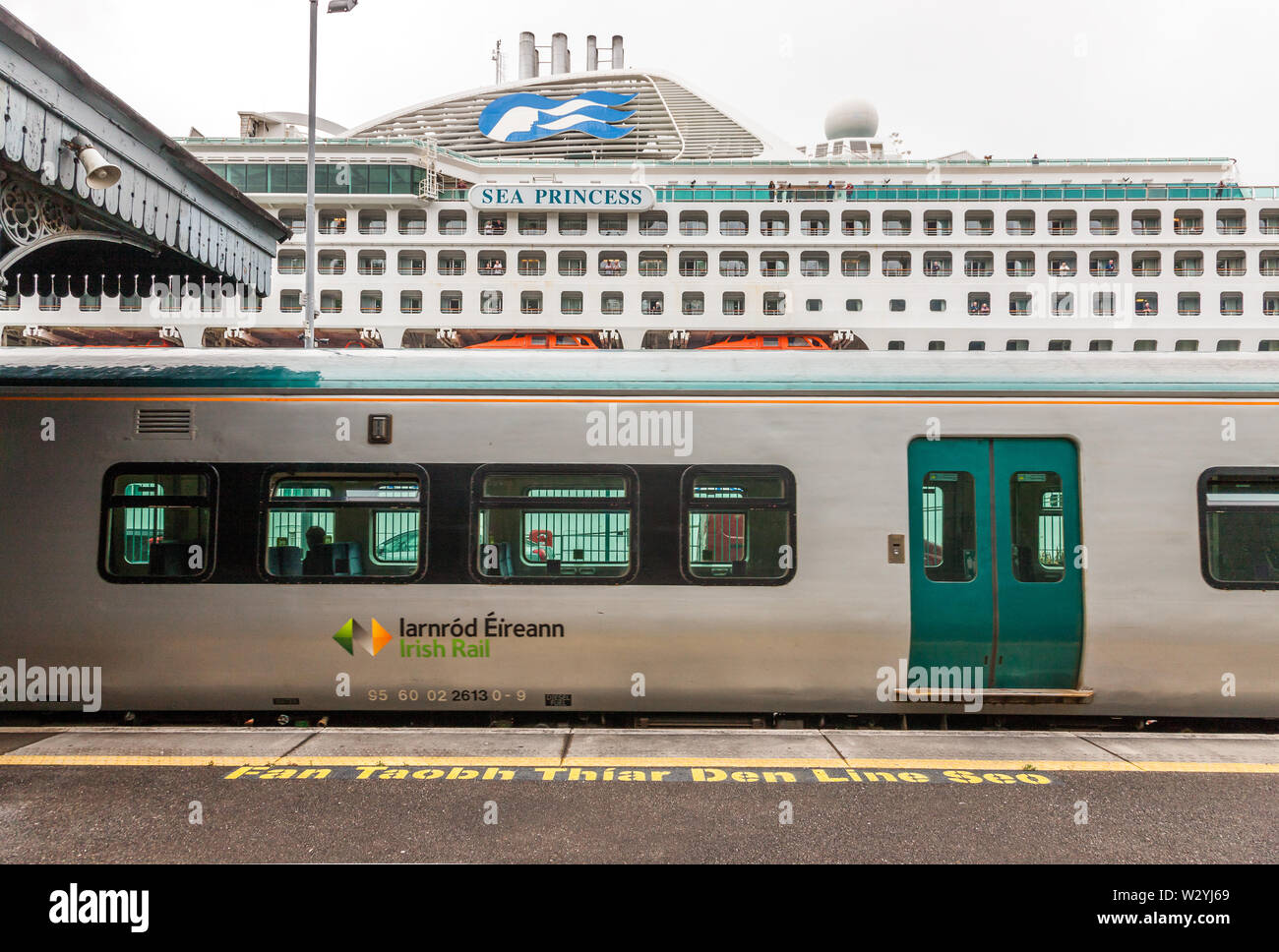 Cobh, Cork, Ireland. 11th July, 2019. Commuter Train departs Cobh Station for Cork as the cruise ship Sea Princess arrives in the historic town where celebrations will take place for Australia Day. Stock Photo