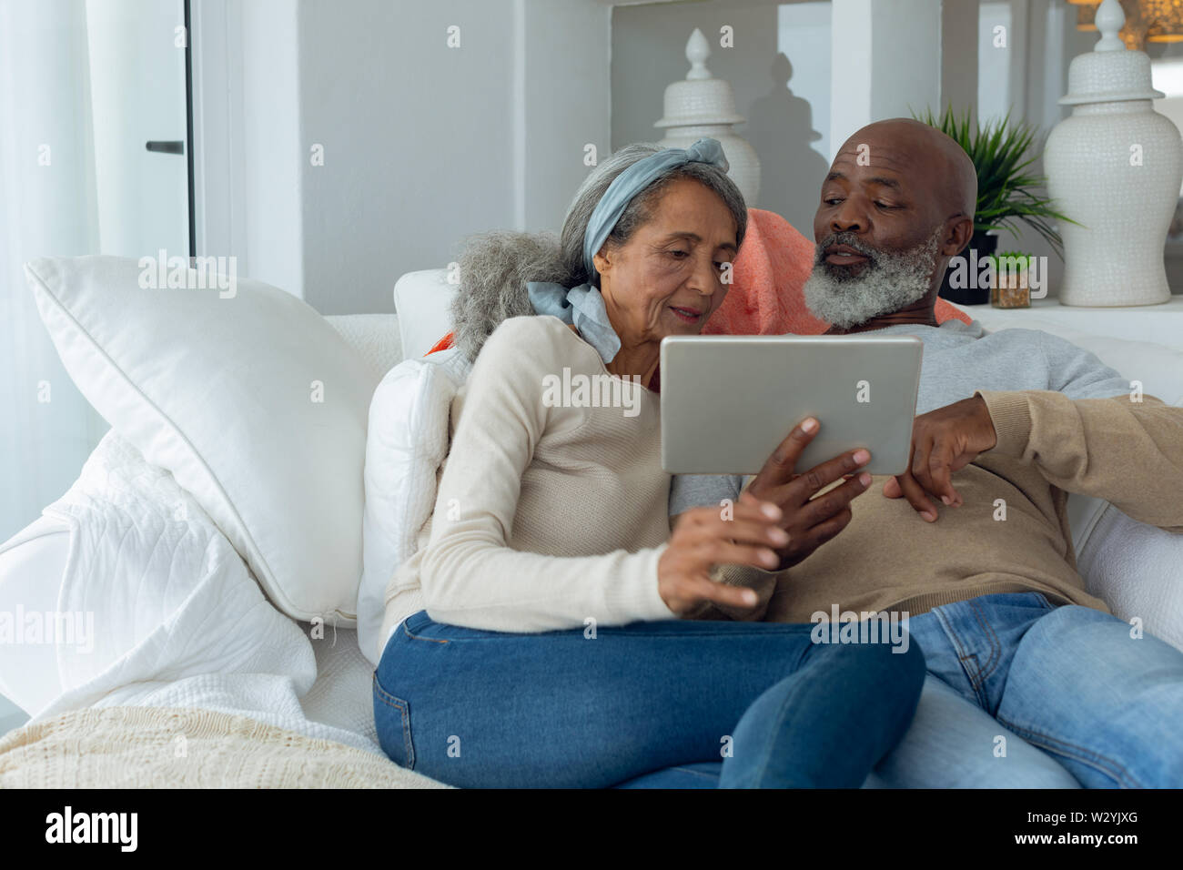 Couple using a digital tablet Stock Photo
