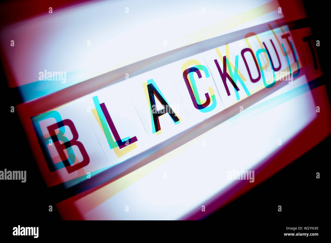 The word blackout on an illuminated panel, power failure Stock Photo