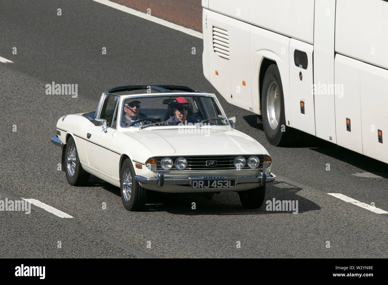 Vintage classic restored vehicles cars traveling on the M6 motorway to
