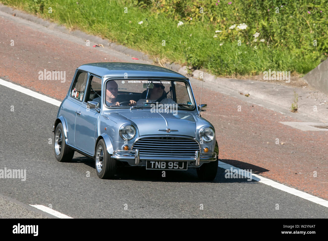 Vintage classic restored vehicles cars traveling on the M6 motorway to