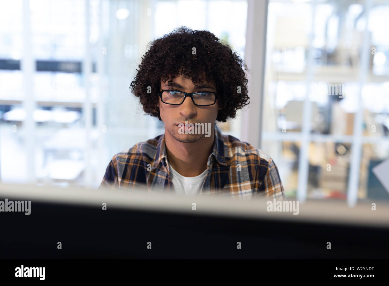 Male graphic designer working on computer Stock Photo